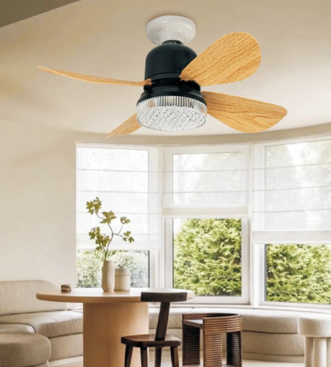 Wood-blade fan light over a dining table